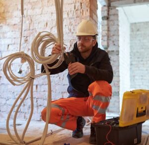 Electrician installing wiring
